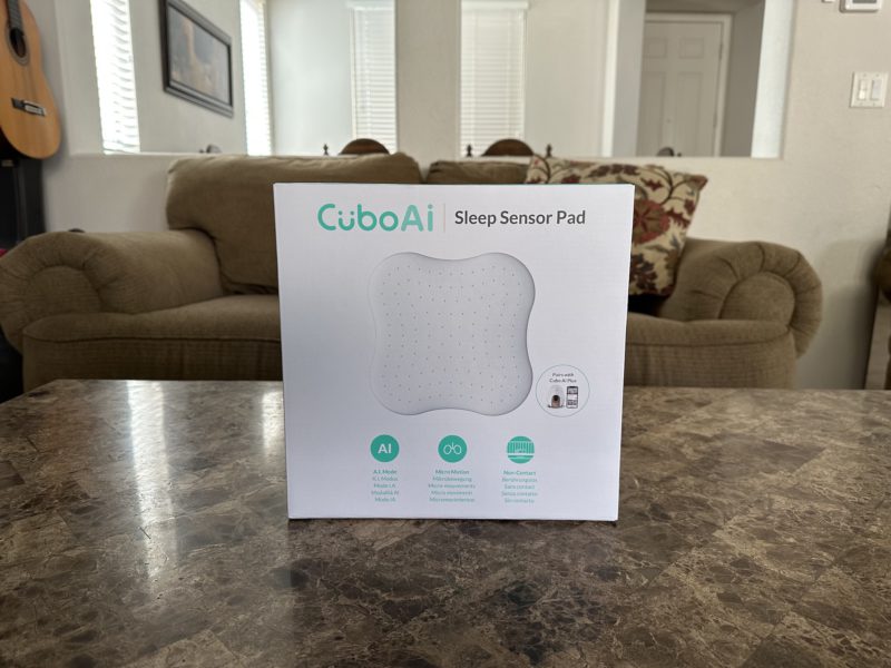 The CuboAi Sleep Sensor Pad still in the box.