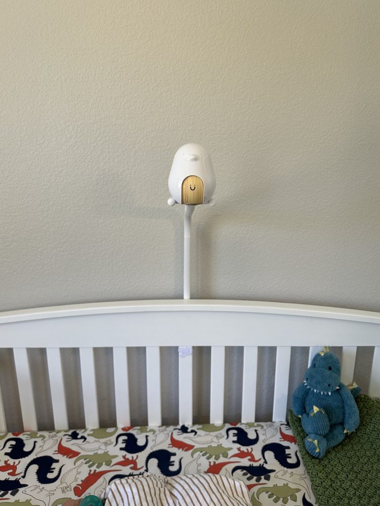 CuboAi Plus attached to the crib using the floor stand.