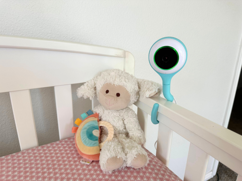 Lollipop baby monitor attached to the crib with blinking green light