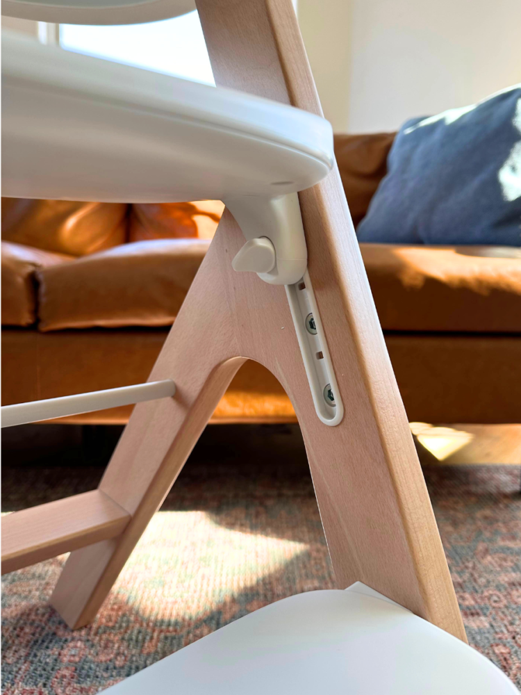 The adjustable seat hardware of the Mockingbird High Chair