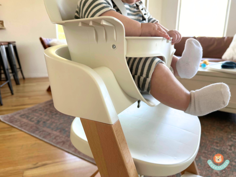 Mockingbird high chair baby seat with babies legs rubbing a little