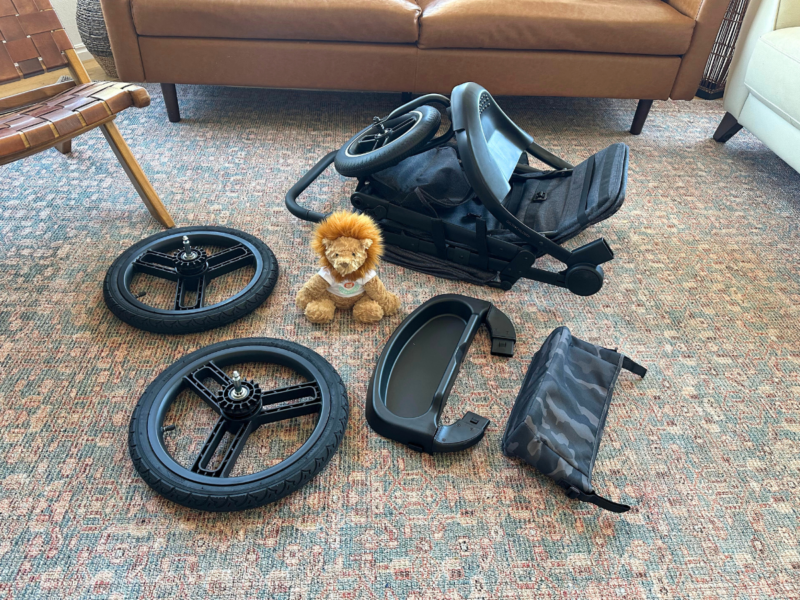 Trek jogging stroller with all the parts laid out