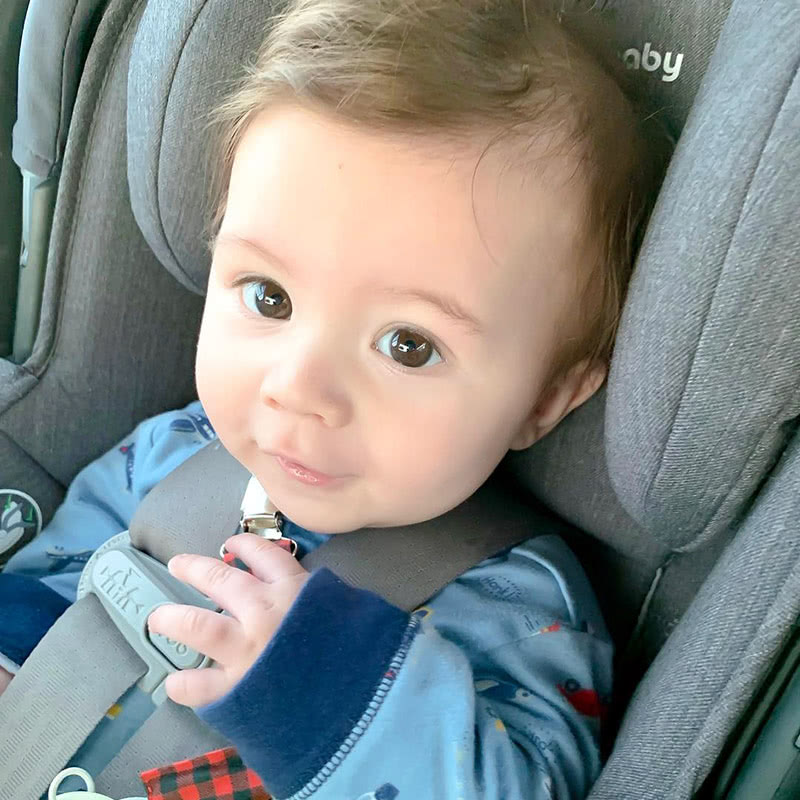 cute smiling baby in car seat